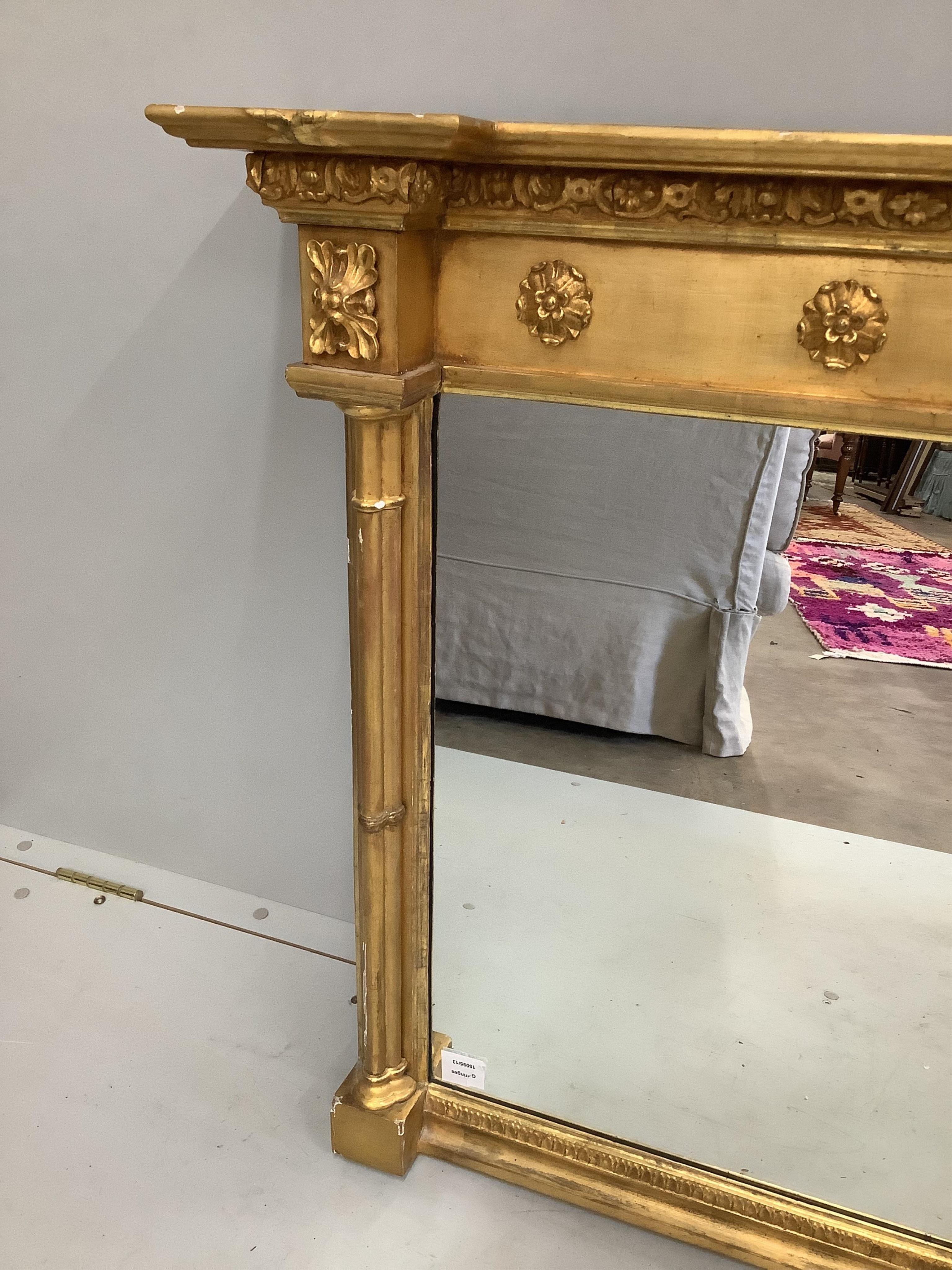 A Regency giltwood and composition overmantel mirror, width 193cm, height 81cm. Condition - fair